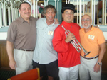 Summer 2006—Avram C. Freedberg is joined by friends Milt Hershenov and Len Kaufman in the Belmont Trustees room with Sam the Bugler, who blows the call for each race.
